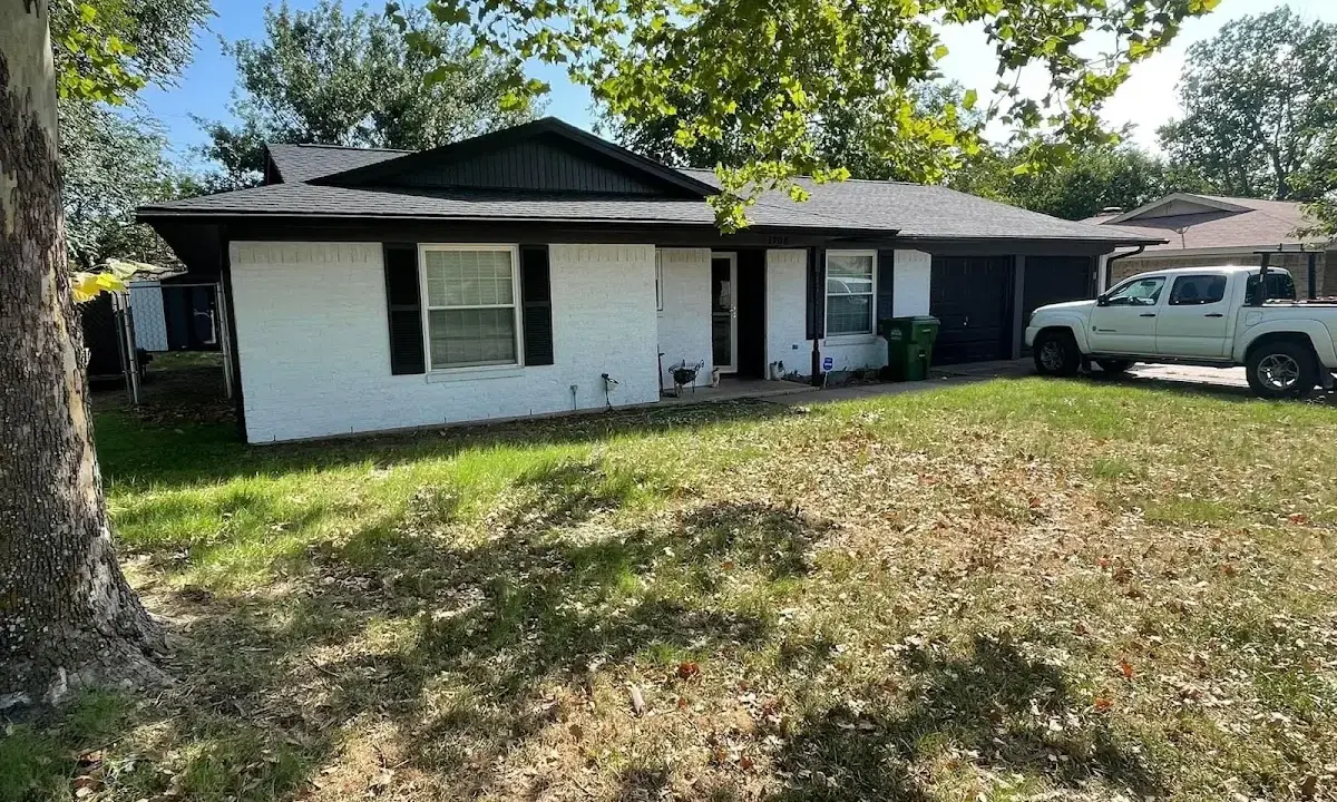Professional roofing crew working on a residential roof in Somers